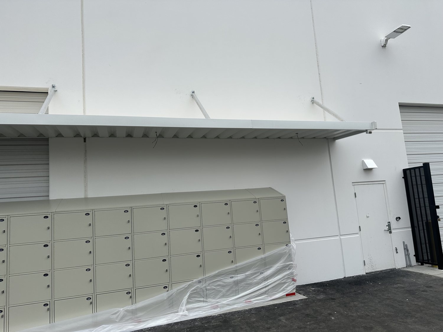 Wall-mount overhead canopy